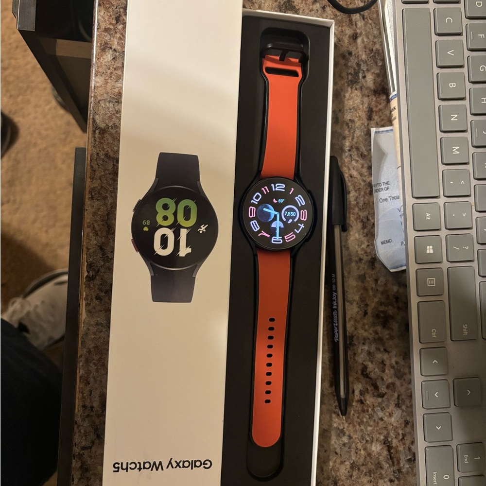 Samsung Galaxy Watch5 with Orange Band